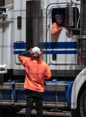 Truck driver talking to a colleague