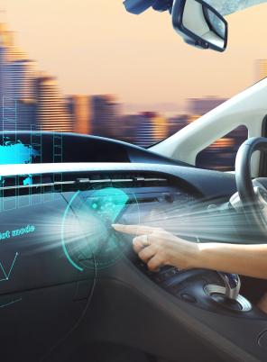 Driver using controls on dashboard of AV vehicle